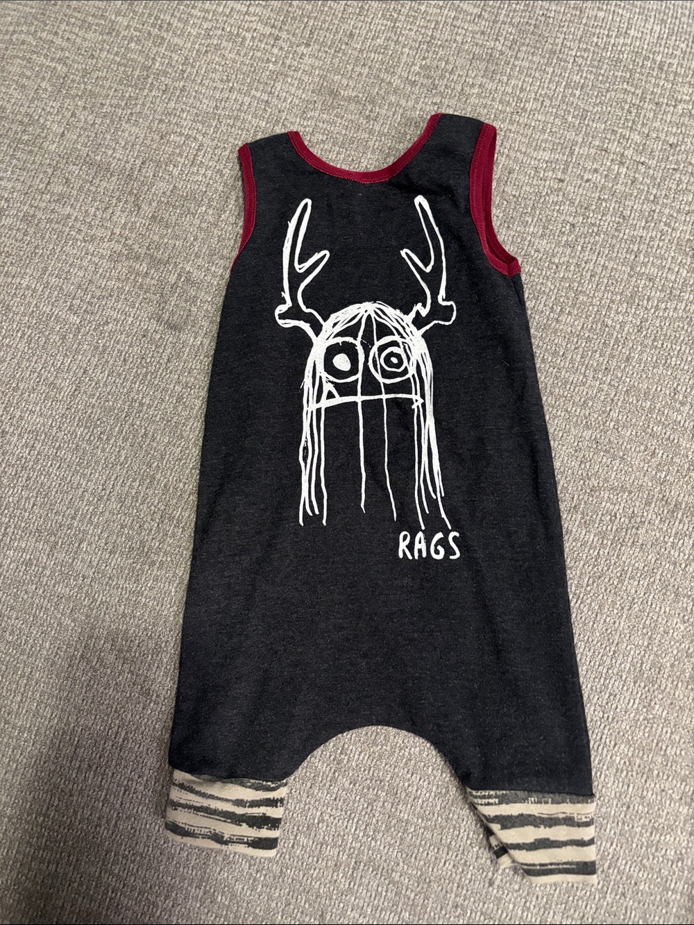 Rags to Raches Black Sleeveless Graphic Romper with Red Trim